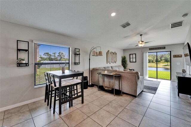 11121 Hudson Hills Ln, Riverview, FL 33579 - dining room featuring a ceiling fan, light tile patterned flooring, and baseboards