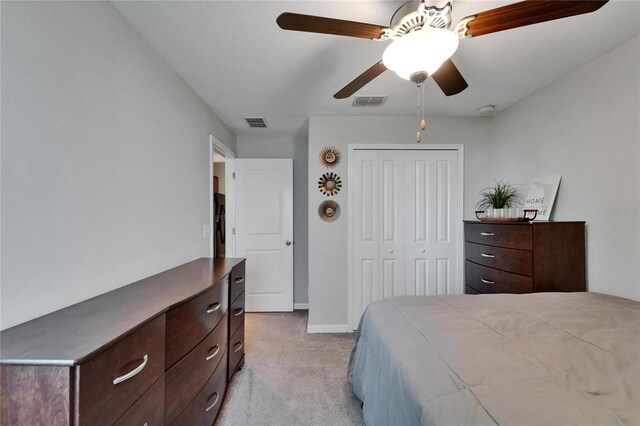 11121 Hudson Hills Ln, Riverview, FL 33579 - bedroom with light colored carpet, a closet, baseboards, and a ceiling fan