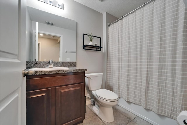 11121 Hudson Hills Ln, Riverview, FL 33579 - full bathroom with tile patterned floors, vanity, toilet, a textured ceiling, and shower / tub combo