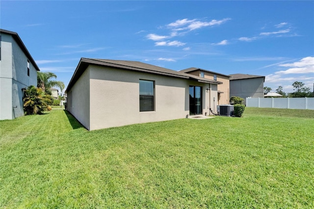 11121 Hudson Hills Ln, Riverview, FL 33579 - rear view of house with stucco siding and cooling unit
