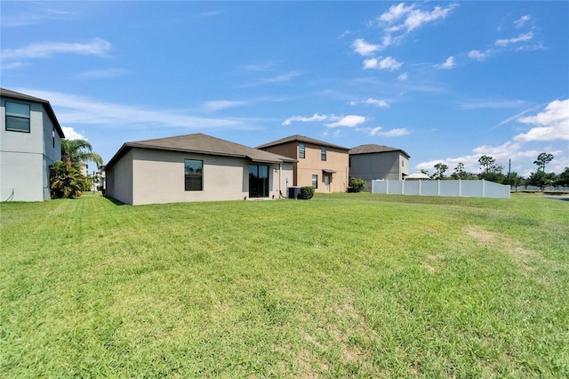 11121 Hudson Hills Ln, Riverview, FL 33579 - rear view of house with stucco siding and central AC