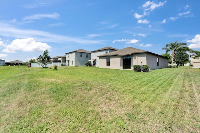 11121 Hudson Hills Ln, Riverview, FL 33579 - back of house with a lawn