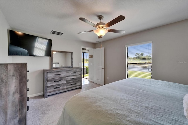 11121 Hudson Hills Ln, Riverview, FL 33579 - bedroom featuring multiple windows, light carpet, and a ceiling fan