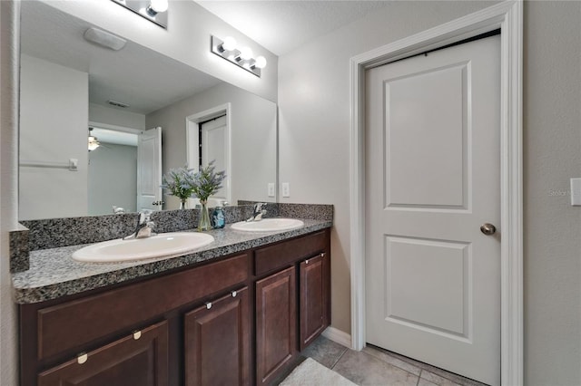 11121 Hudson Hills Ln, Riverview, FL 33579 - full bathroom featuring double vanity, tile patterned floors, and ceiling fan