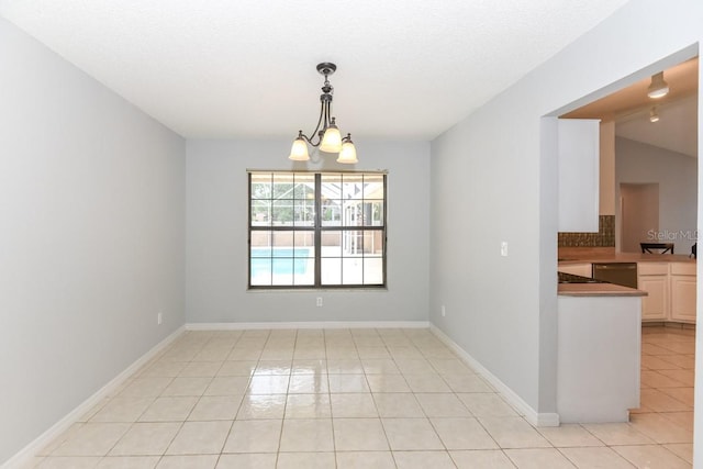 24 Lake Vista Way, Ormond Beach, FL 32174 - unfurnished room with light tile patterned floors and a chandelier