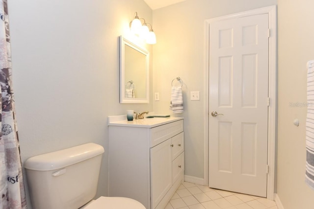 24 Lake Vista Way, Ormond Beach, FL 32174 - bathroom featuring tile patterned flooring, toilet, vanity, and baseboards