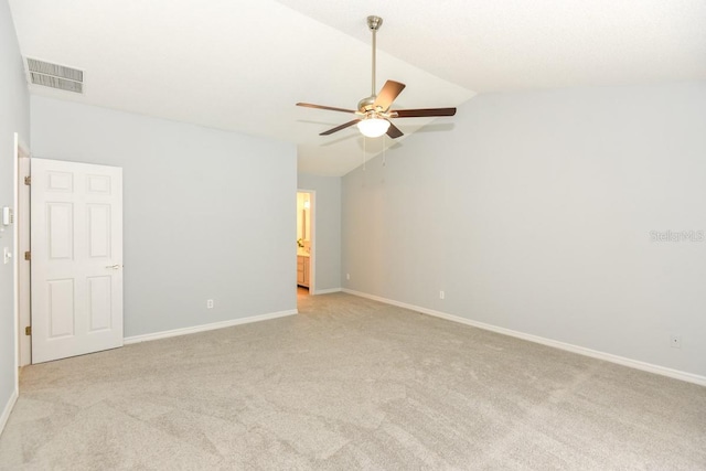 24 Lake Vista Way, Ormond Beach, FL 32174 - empty room featuring light colored carpet, vaulted ceiling, ceiling fan, and baseboards