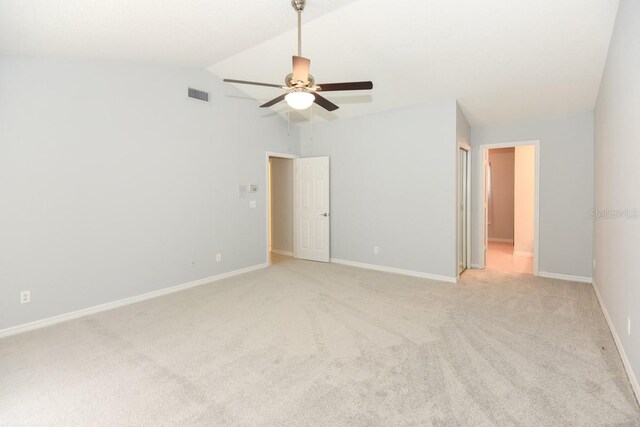 24 Lake Vista Way, Ormond Beach, FL 32174 - empty room with ceiling fan, light carpet, vaulted ceiling, and baseboards