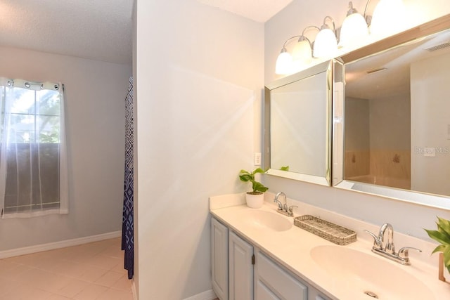 24 Lake Vista Way, Ormond Beach, FL 32174 - bathroom with tile patterned floors, double vanity, and baseboards