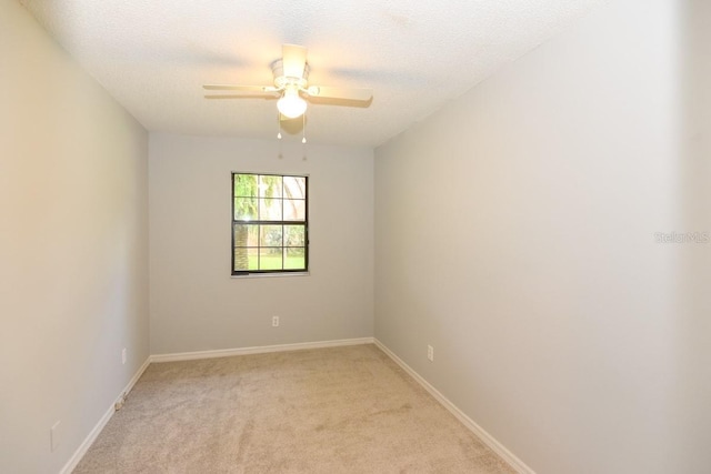24 Lake Vista Way, Ormond Beach, FL 32174 - unfurnished room with light carpet, a ceiling fan, baseboards, and a textured ceiling