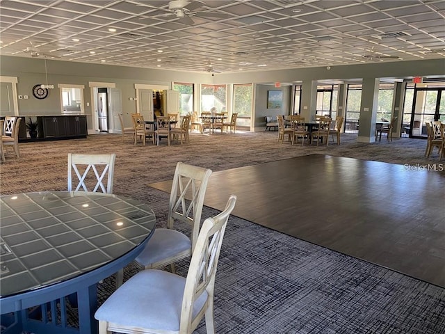 24 Lake Vista Way, Ormond Beach, FL 32174 - dining room featuring carpet flooring, ceiling fan, and baseboards