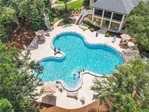 24 Lake Vista Way, Ormond Beach, FL 32174 - swimming pool featuring a patio area