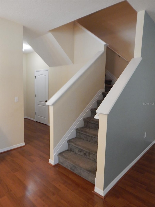 16618 Kingletside Ct, Lithia, FL 33547 - stairway featuring wood finished floors and baseboards