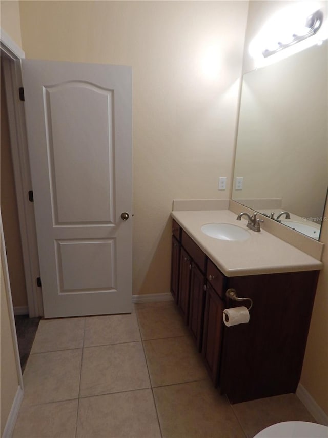 16618 Kingletside Ct, Lithia, FL 33547 - half bathroom featuring vanity, tile patterned floors, and baseboards