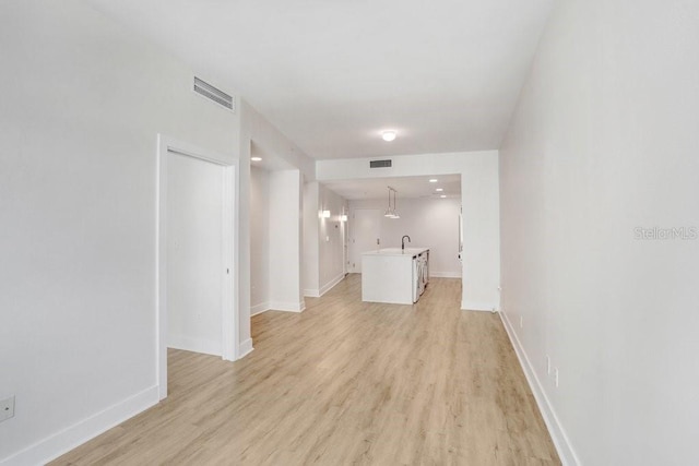 1120 E Kennedy Blvd Unit 1127, Tampa, FL 33602 - hall with light wood-style floors and baseboards