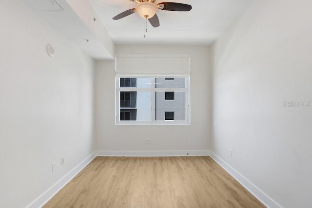 1120 E Kennedy Blvd Unit 1127, Tampa, FL 33602 - unfurnished room with light wood-style flooring, ceiling fan, and baseboards