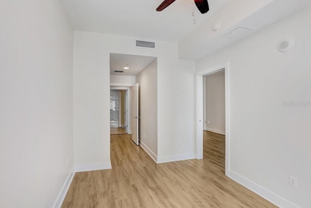 1120 E Kennedy Blvd Unit 1127, Tampa, FL 33602 - unfurnished room featuring light wood-type flooring, baseboards, and ceiling fan