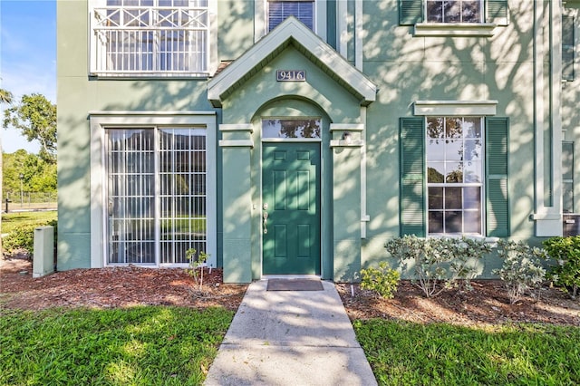 9416 Lake Chase Island Way Unit 9416, Tampa, FL 33626 - property entrance with stucco siding