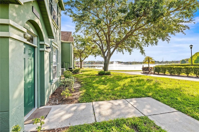 9416 Lake Chase Island Way Unit 9416, Tampa, FL 33626 - view of grassy yard featuring a water view