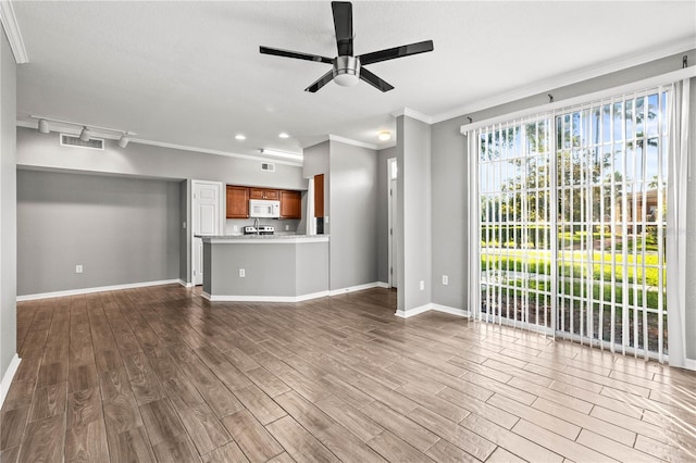 9416 Lake Chase Island Way Unit 9416, Tampa, FL 33626 - unfurnished living room featuring ornamental molding, baseboards, ceiling fan, dark wood-style flooring, and recessed lighting