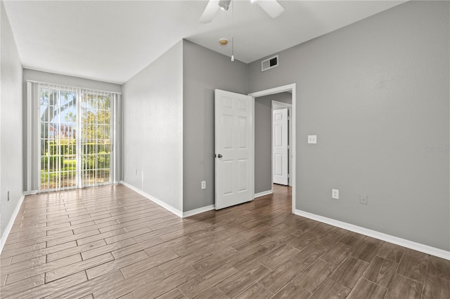 9416 Lake Chase Island Way Unit 9416, Tampa, FL 33626 - unfurnished room with wood finished floors, ceiling fan, and baseboards