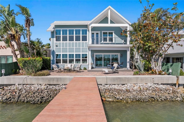 2903 Pass A Grille Way, St Pete Beach, FL 33706 - back of house with a patio, a balcony, and a water view