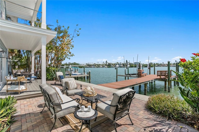 2903 Pass A Grille Way, St Pete Beach, FL 33706 - view of patio / terrace with boat lift, a dock, and a water view