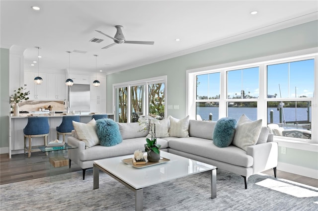 2903 Pass A Grille Way, St Pete Beach, FL 33706 - living area featuring dark wood finished floors, recessed lighting, a ceiling fan, a water view, and baseboards
