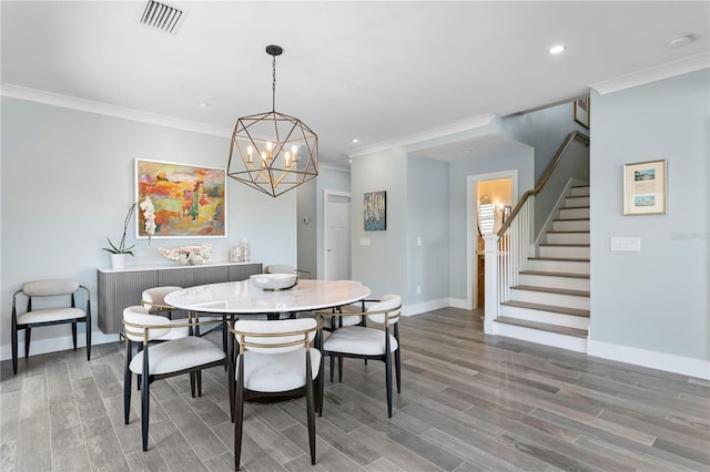 2903 Pass A Grille Way, St Pete Beach, FL 33706 - dining room featuring stairway, wood finished floors, baseboards, recessed lighting, and crown molding