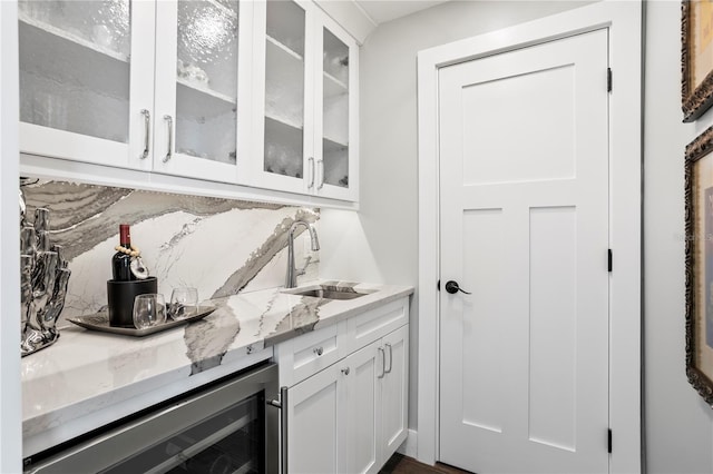 2903 Pass A Grille Way, St Pete Beach, FL 33706 - bar area featuring a sink, beverage cooler, and decorative backsplash