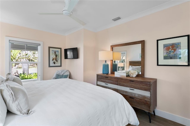 2903 Pass A Grille Way, St Pete Beach, FL 33706 - bedroom with wood finished floors, baseboards, crown molding, and ceiling fan