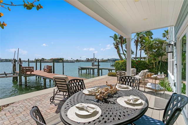 2903 Pass A Grille Way, St Pete Beach, FL 33706 - view of patio featuring boat lift, a dock, and a water view