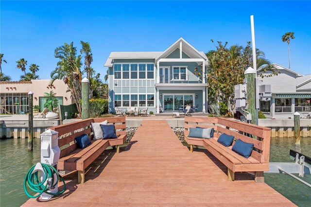 2903 Pass A Grille Way, St Pete Beach, FL 33706 - rear view of property with a water view and a balcony