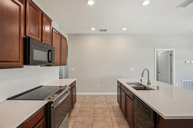 10326 Boggy Moss Dr, Riverview, FL 33578 - kitchen with black appliances, a sink, light countertops, an island with sink, and recessed lighting