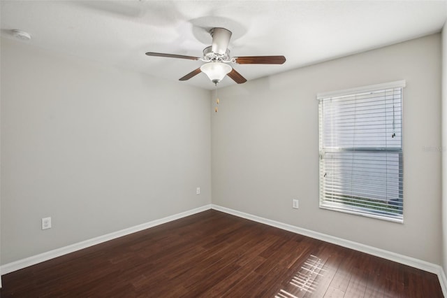10326 Boggy Moss Dr, Riverview, FL 33578 - unfurnished room with dark wood-style flooring, baseboards, a ceiling fan, and a smoke detector