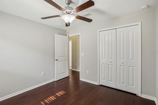 10326 Boggy Moss Dr, Riverview, FL 33578 - unfurnished bedroom featuring dark wood finished floors, baseboards, and a closet