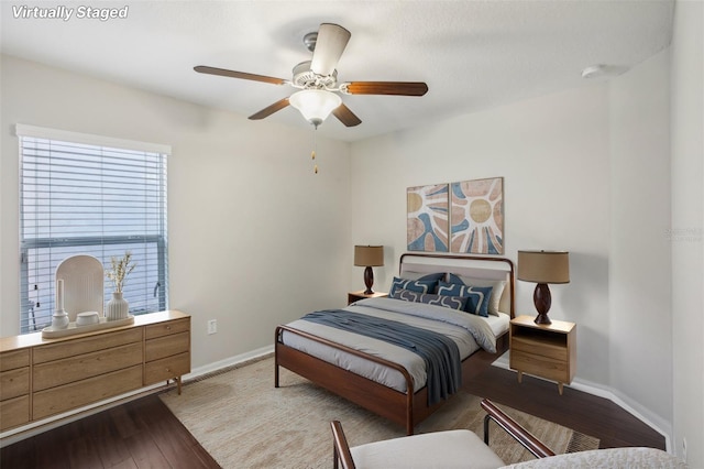 10326 Boggy Moss Dr, Riverview, FL 33578 - bedroom featuring wood finished floors, baseboards, and a ceiling fan