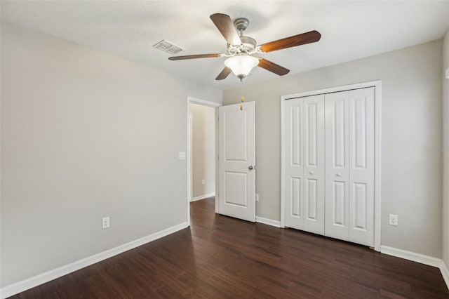 10326 Boggy Moss Dr, Riverview, FL 33578 - unfurnished bedroom featuring dark wood finished floors, baseboards, a closet, and a ceiling fan