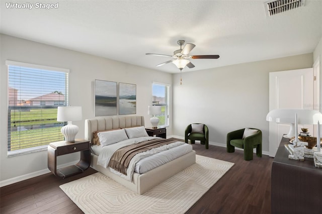 10326 Boggy Moss Dr, Riverview, FL 33578 - bedroom with baseboards, wood finished floors, and a ceiling fan