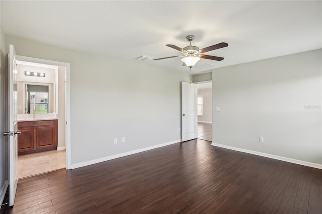 10326 Boggy Moss Dr, Riverview, FL 33578 - unfurnished room featuring dark wood-style flooring, baseboards, and ceiling fan