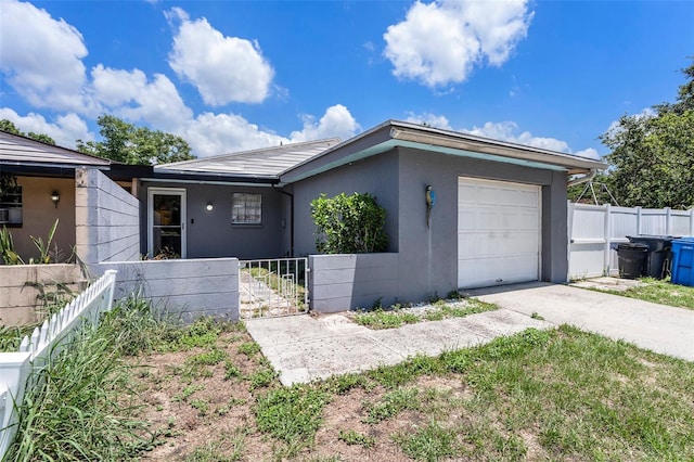 702 Regent Cir S, Brandon, FL 33511 - ranch-style house with driveway, a garage, stucco siding, and a gate