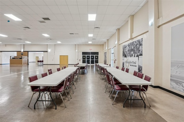 2416 World Parkway Blvd Unit 26, Clearwater, FL 33763 - dining room featuring a drop ceiling and baseboards