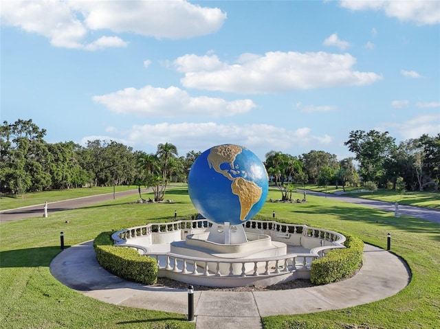 2416 World Parkway Blvd Unit 26, Clearwater, FL 33763 - view of property's community featuring a yard and view of wooded area