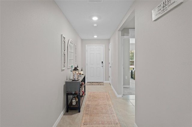 8508 Bay Dr, Spring Hill, FL 34606 - hall featuring baseboards, light tile patterned floors, and recessed lighting