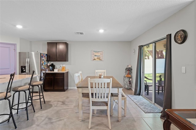 8508 Bay Dr, Spring Hill, FL 34606 - dining area with recessed lighting and a textured ceiling