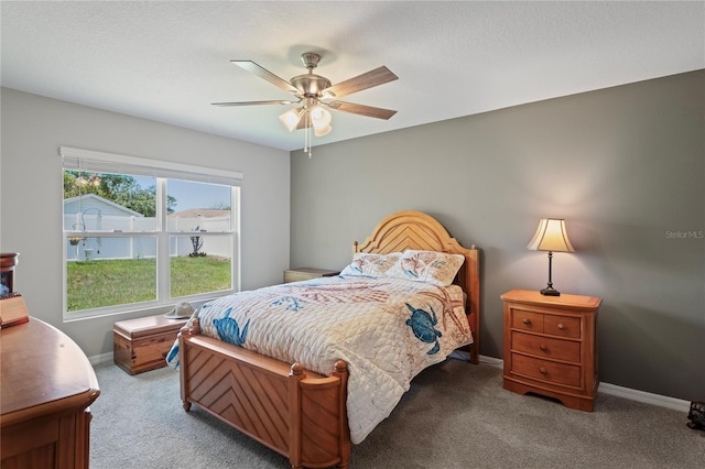8508 Bay Dr, Spring Hill, FL 34606 - bedroom with carpet flooring, baseboards, and a ceiling fan