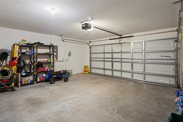 8508 Bay Dr, Spring Hill, FL 34606 - garage featuring a garage door opener and electric panel