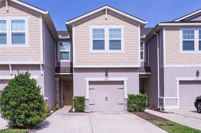 14245 Damselfly Dr, Tampa, FL 33625 - multi unit property with an attached garage, concrete driveway, and stucco siding