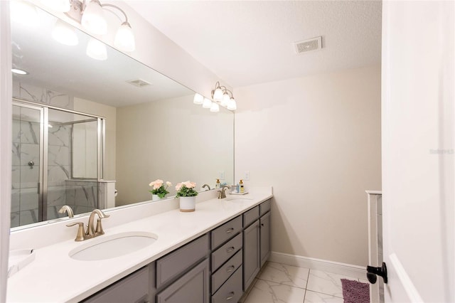 14245 Damselfly Dr, Tampa, FL 33625 - full bathroom with baseboards, a shower stall, marble look tile flooring, and double vanity
