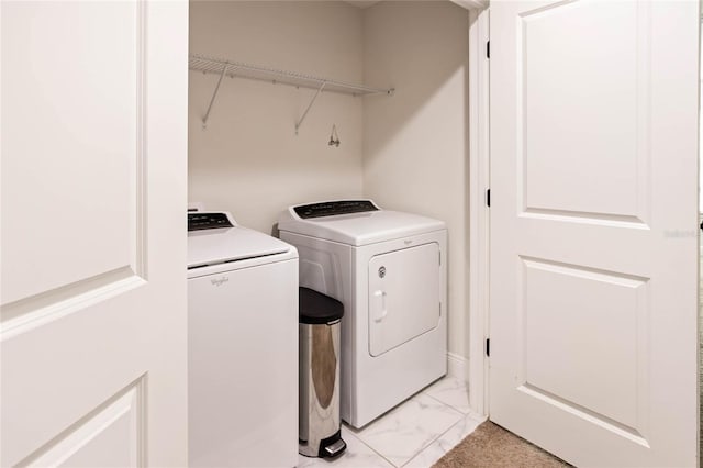 14245 Damselfly Dr, Tampa, FL 33625 - washroom featuring washing machine and clothes dryer and light marble finish floors